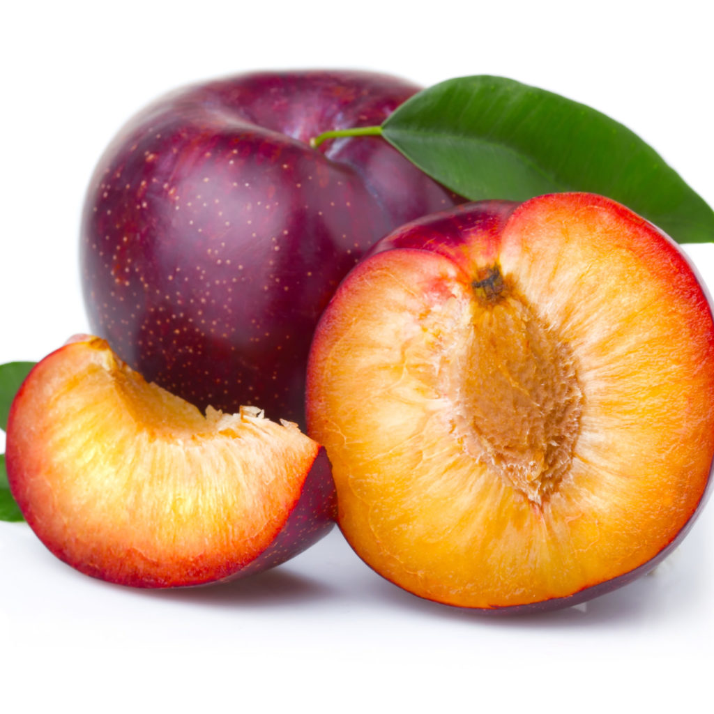 Ripe Purple Plum Fruits With Green Leaves Isolated