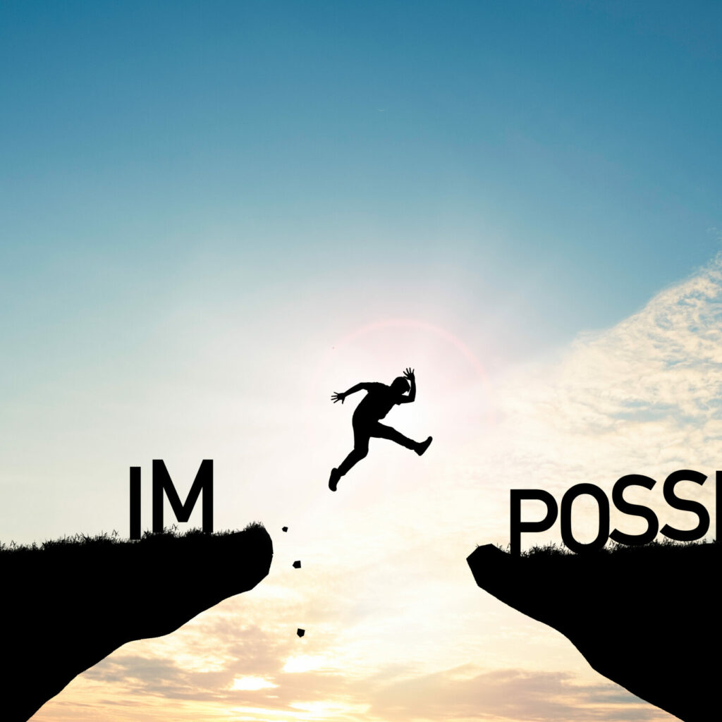 Mindset Concept ,silhouette Man Jumping Over Impossible And Poss