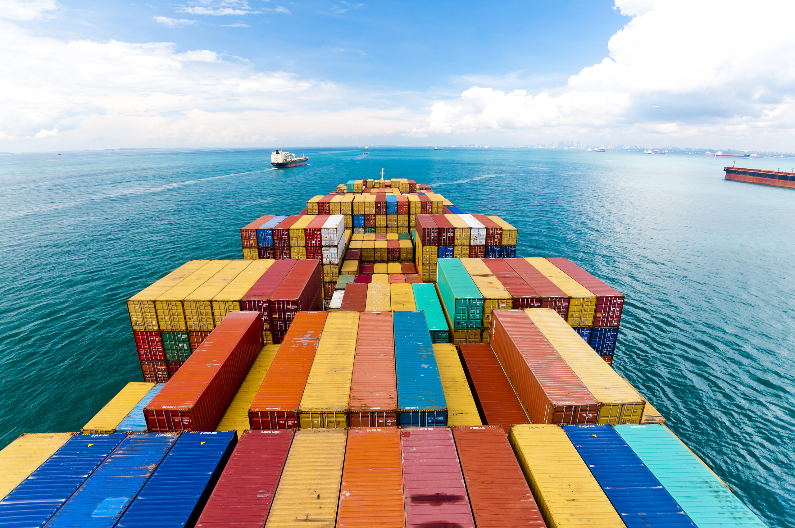Cargo Ships Entering One Of The Busiest Ports In The World, Singapore.