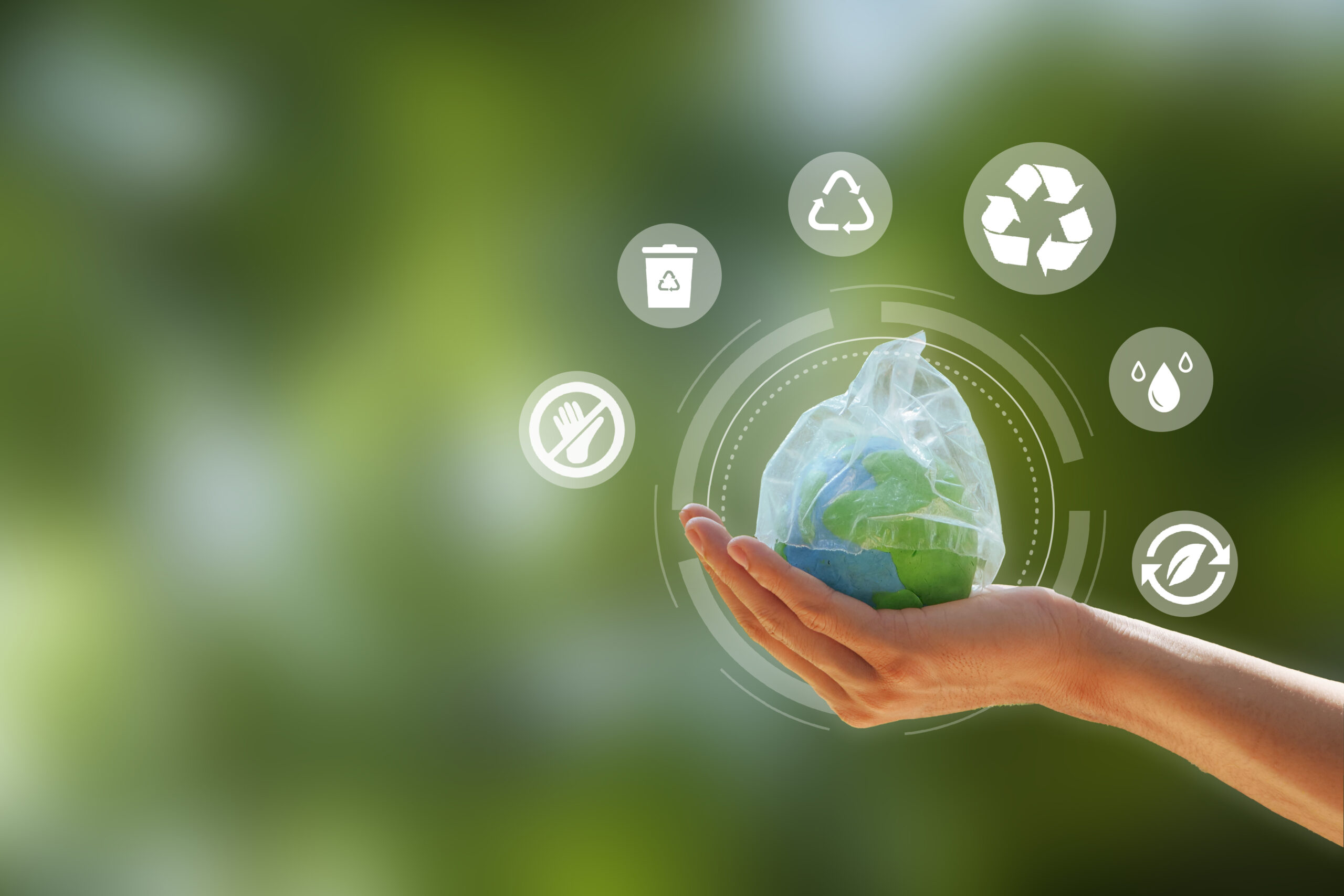 Zero Waste. Hand Holding The Earth That Plastic Bag Covering On A Green Background. Concept Of Reuse Reduce Recycle Rot Refuse. Zero Waste. Conscious Consumption. Save Water, World Water Day.